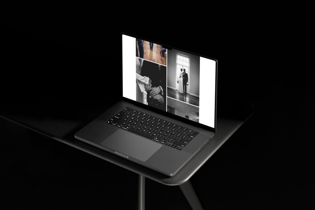 A laptop showcasing a black and white wedding photography portfolio, set against a dark background, highlighting the intimate moments captured in the photos.