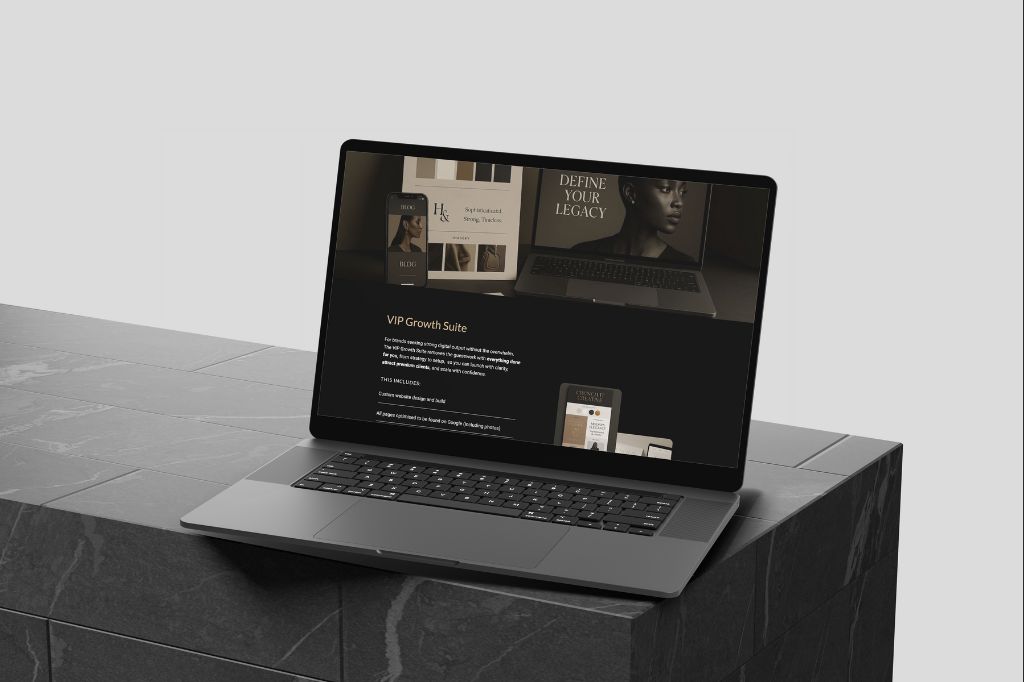 Laptop screen featuring the VIP Growth Suite website redesign offer with mobile and desktop mockups in a muted, elegant color palette.